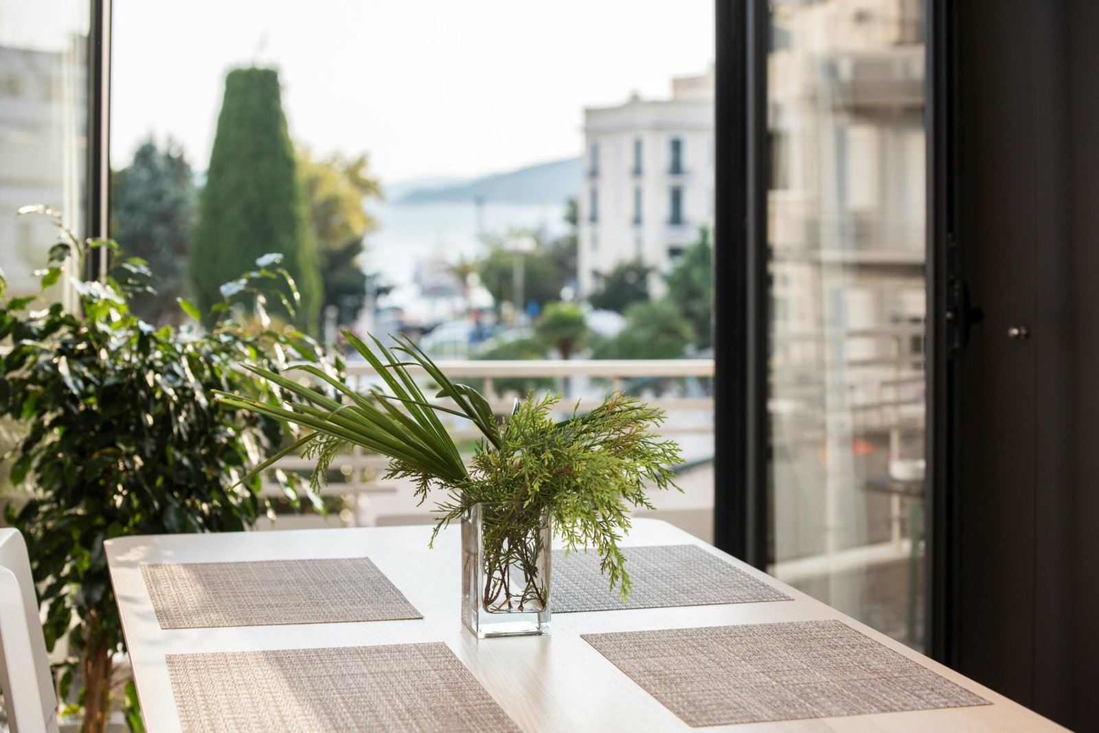 Elegant dining space with decor and view of Kavala's architecture.